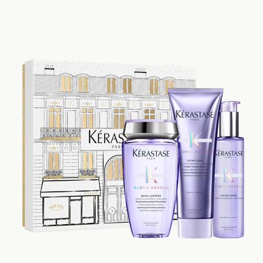 Kérastase Blond Absolu Fondant Holidays Coffret on ylellinen lahjapakkaus, joka sisältää kolme hiustenhoidon huipputuotetta vaalennetuille, raidoitetuille ja harmaille hiuksille.