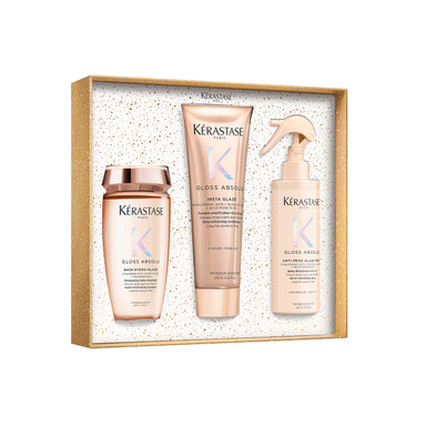 Kérastase Gloss Absolu Holiday Set sisältää shampoon, hoitoaineen ja lämpösuojasuihkeen pitkille, pörröisille hiuksille.